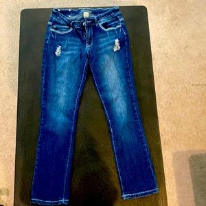 Red rivet jeans with small distressing details